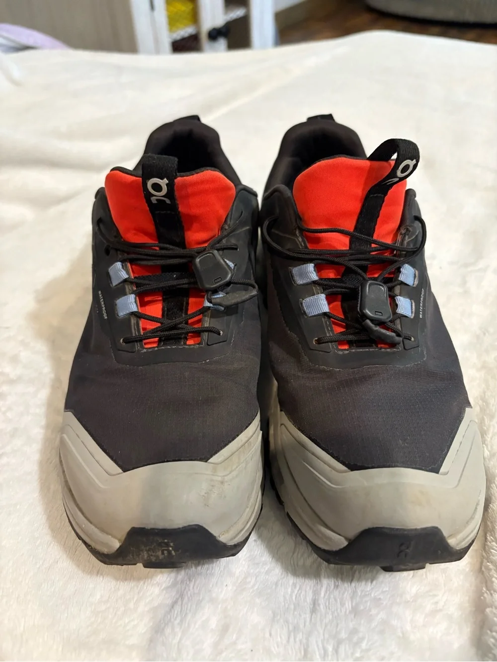 On Running Men's Trail Sneakers in Black, Gray and Red Accent
